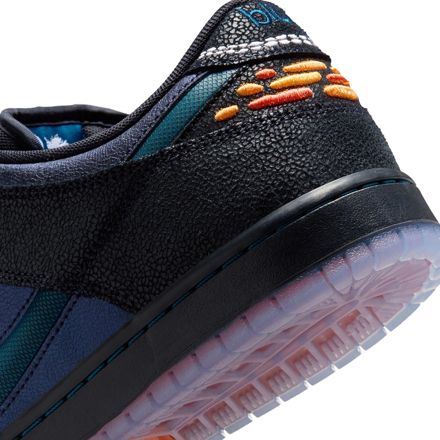 Close up of Black and marina Nike SB Dunk Low Pro men's skateboarding sneaker on a white background 