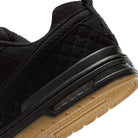 Close up of Black and gum Nike SB Paul Rodriguez pro model men's skateboarding sneaker on a white background