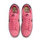 Top view of Hyper Pink Nike SB Zoom Tennis Classic skateboard sneakers with black sole and swoosh branding on a white background