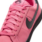 Front of Hyper Pink Nike SB Zoom Tennis Classic skateboard sneaker with black sole and swoosh branding on a white background