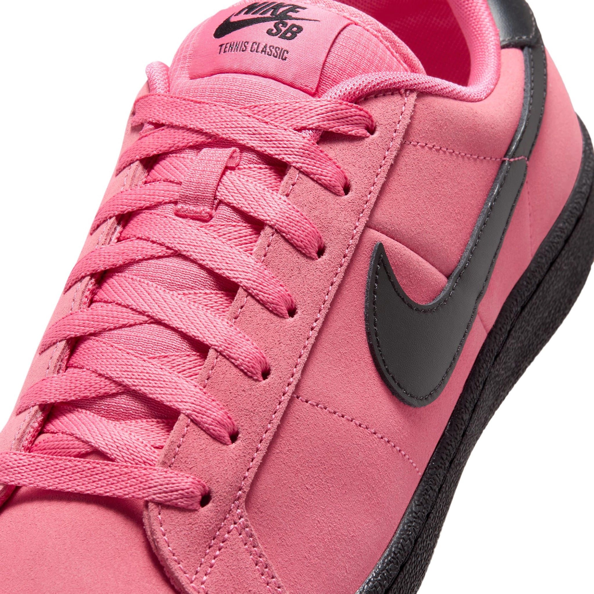 Front of Hyper Pink Nike SB Zoom Tennis Classic skateboard sneaker with black sole and swoosh branding on a white background