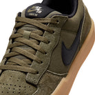 Front of Medium olive Nike SB Force 58 skateboard sneaker with black swoosh branding on a white background
