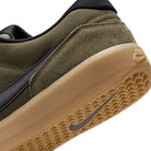 Detail of Medium olive Nike SB Force 58 skateboard sneaker with black swoosh branding on a white background