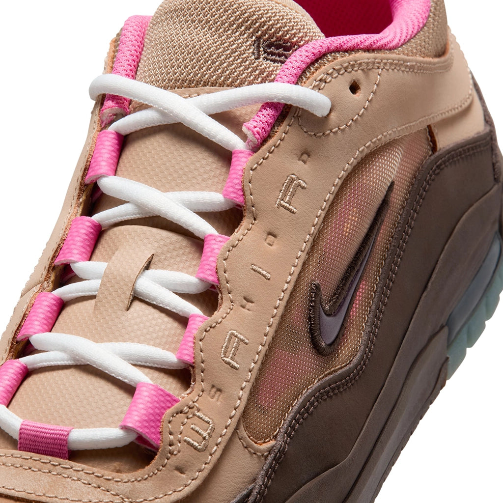 Tan Nike SB Ishod sneaker with pink and white laces on a white background