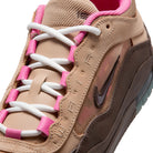 Tan Nike SB Ishod sneaker with pink and white laces on a white background