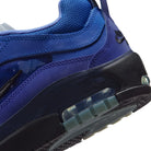 Detail of Blue void Nike SB Ishod Wair Air Max skateboard sneaker with Silver Metallic swoosh branding on a white background