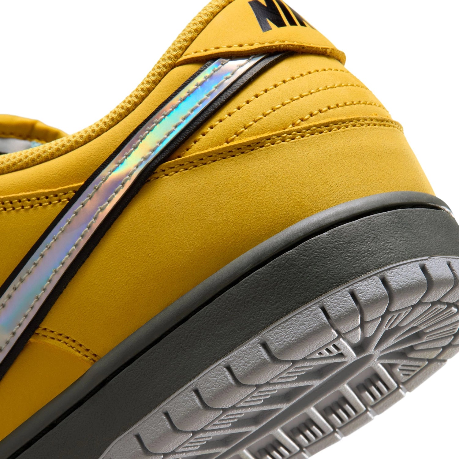Close up of Lightening wolf grey Nike SB Dunk Low Pro men's skateboard sneaker on a white background