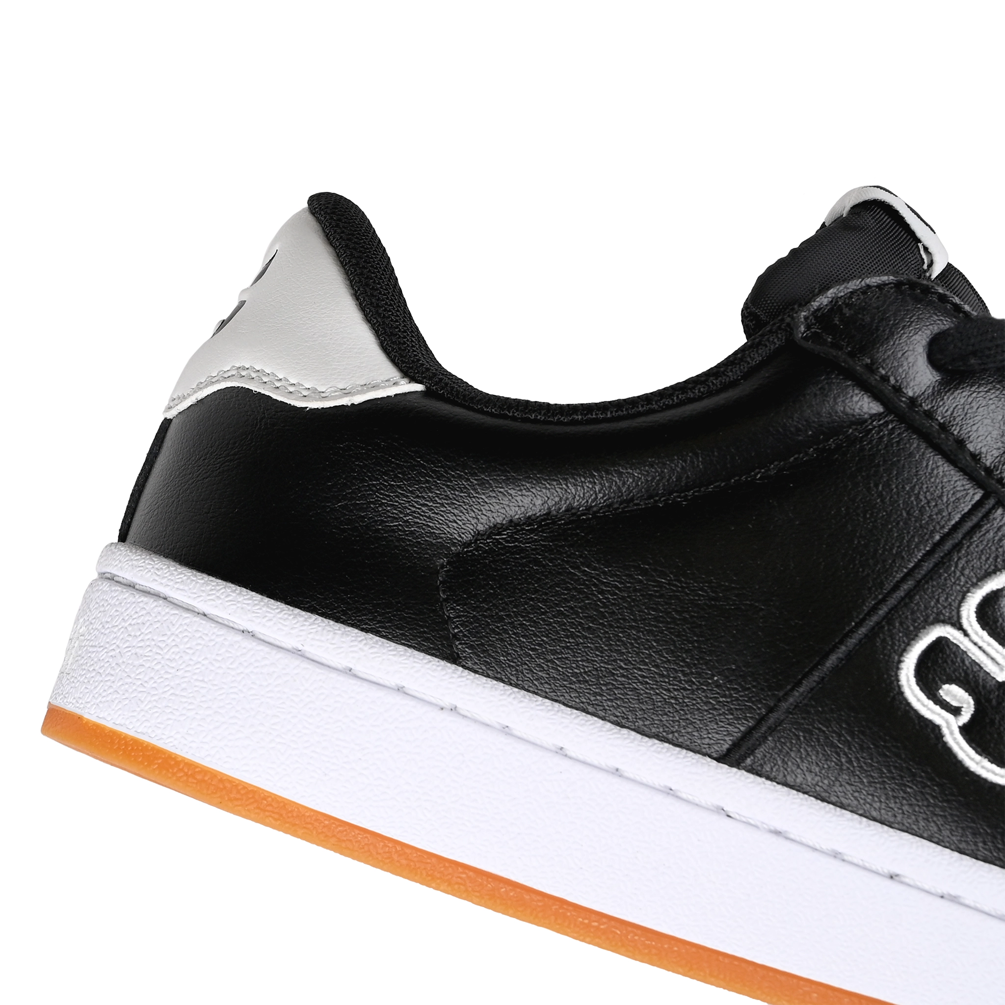 Detail of Black leather I-Path Footwear Ace skateboarding sneaker on a white background