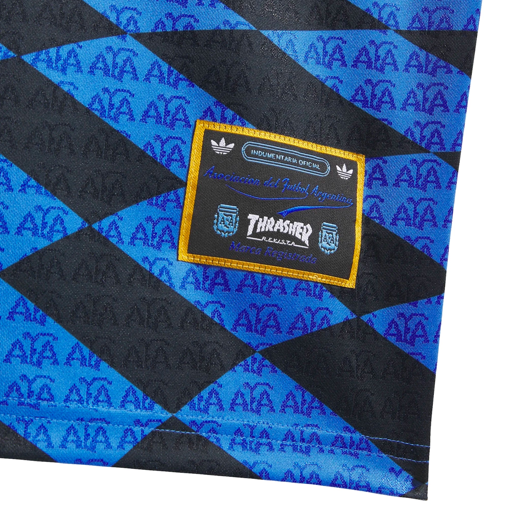 Woven patch on a Blue and black checkered adidas Skateboarding x Thrasher Magazine x Argentina Football Association  polo jersey on a white background