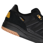 Detail of core black adidas Skateboarding Tekkira Cup skateboard sneaker on a white background