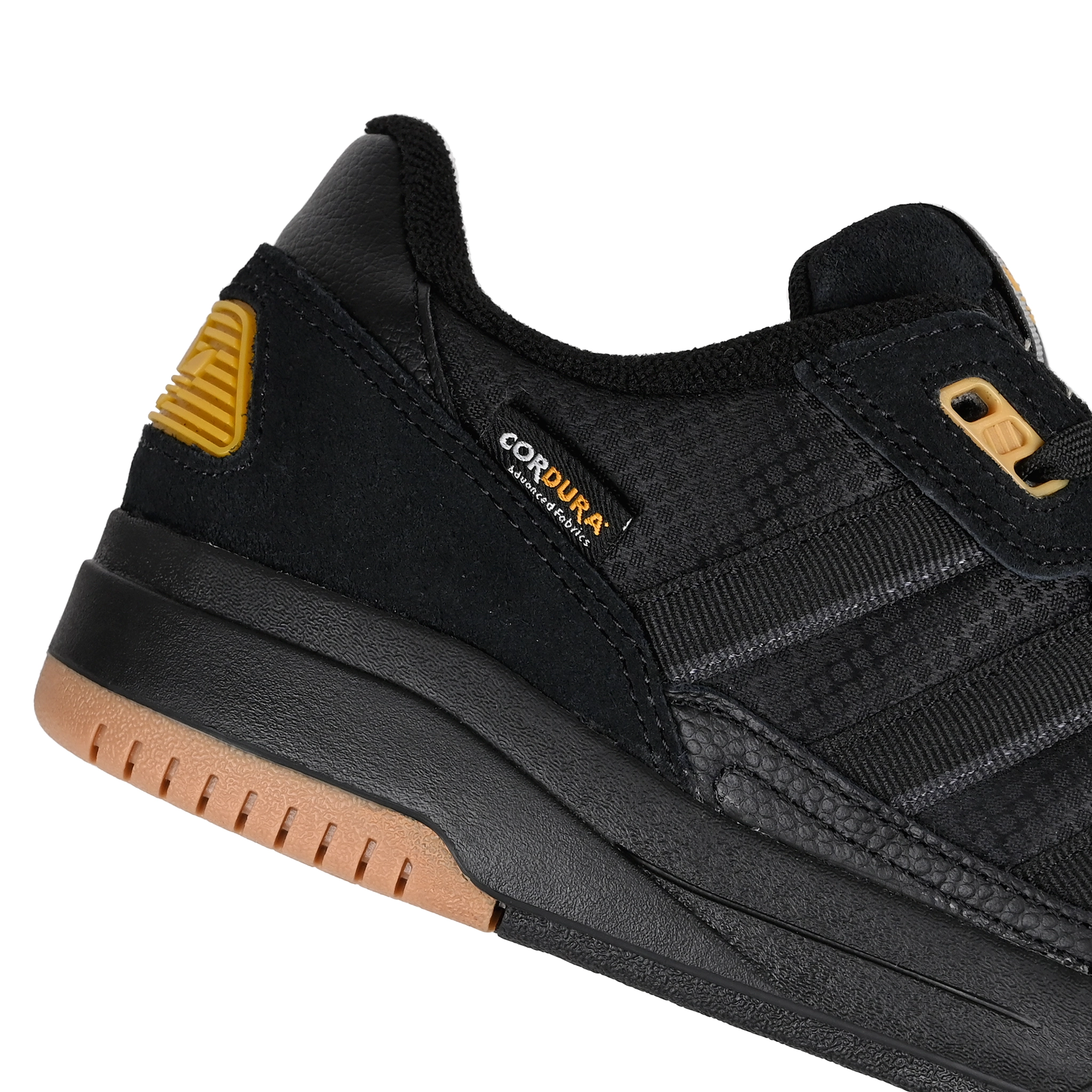 Detail of core black adidas Skateboarding Tekkira Cup skateboard sneaker on a white background