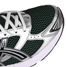 Toe box of Evergreen and silver Asics GEL-1130 Sportstyle sneaker with Onitsuka branding on a white background