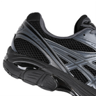 Detail Black Asics GT-2160 Sportstyle sneaker with carbon grey 'onitsuka' branding on a white background
