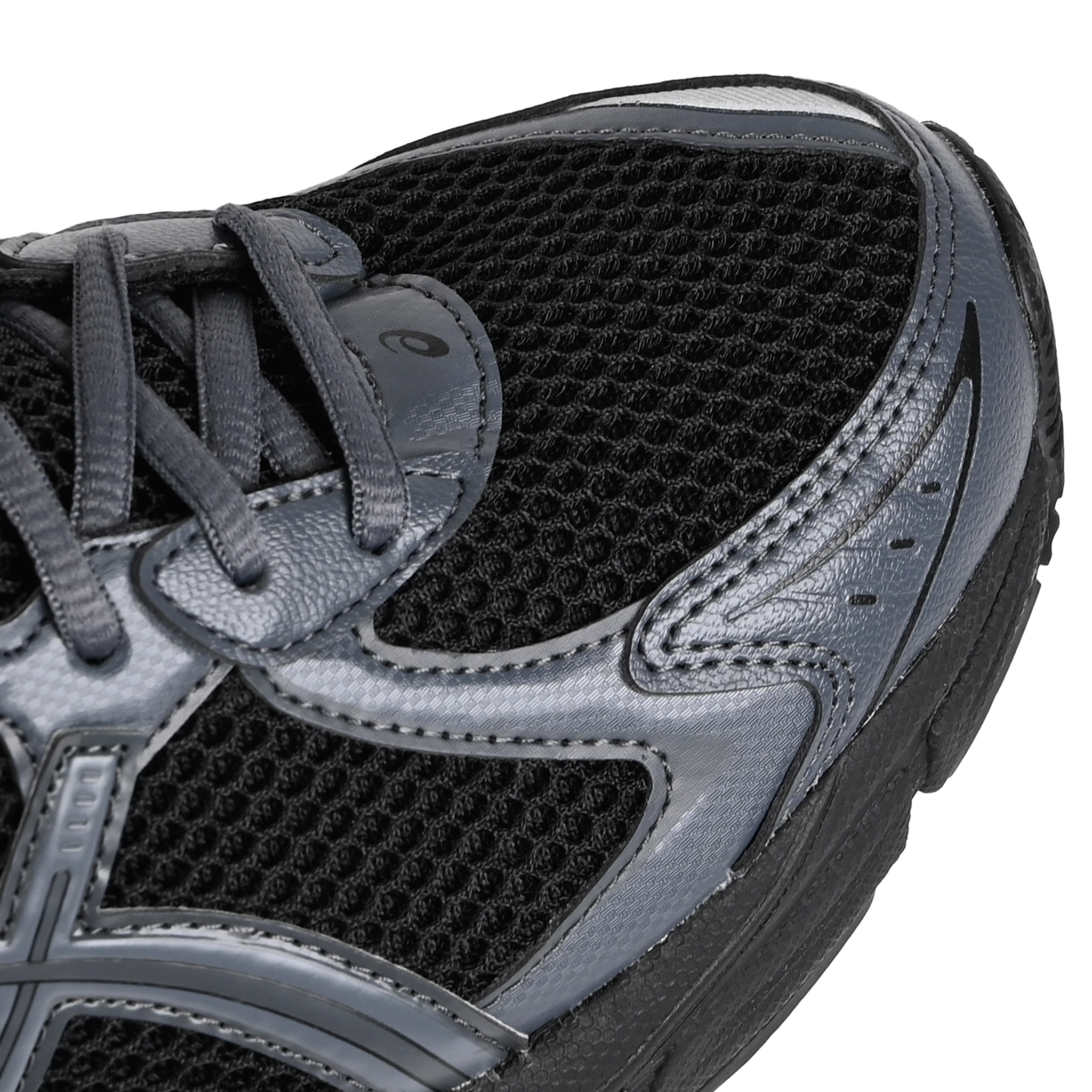 Toe box of Black Asics GT-2160 Sportstyle sneaker with carbon grey 'onitsuka' branding on a white background