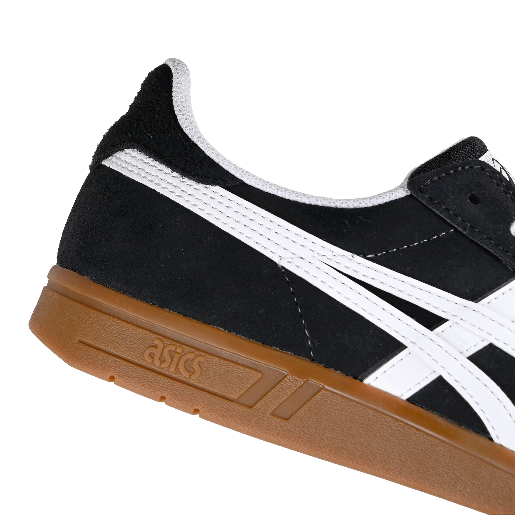 Detail of Black suede Asics Skateboarding Gel-Vickka Pro skateboard sneaker with a gum sole and white Onitsuka branding on a white background