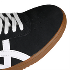 Toe box of Black suede Asics Skateboarding Gel-Vickka Pro skateboard sneaker with a gum sole and white Onitsuka branding on a white background