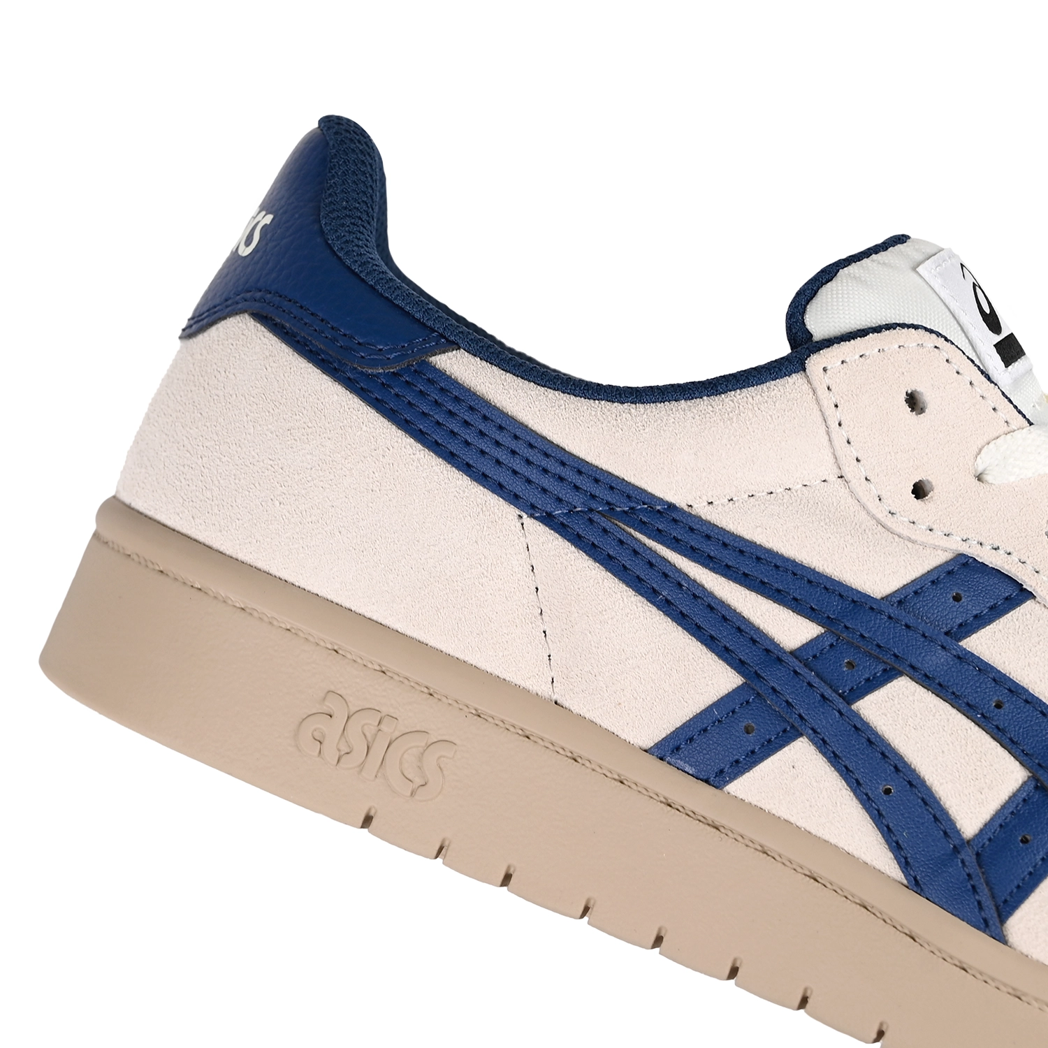 Close up of Asics Skateboarding Japan Pro cream and blue sneakers with 'Onitsuka' branding on a white background