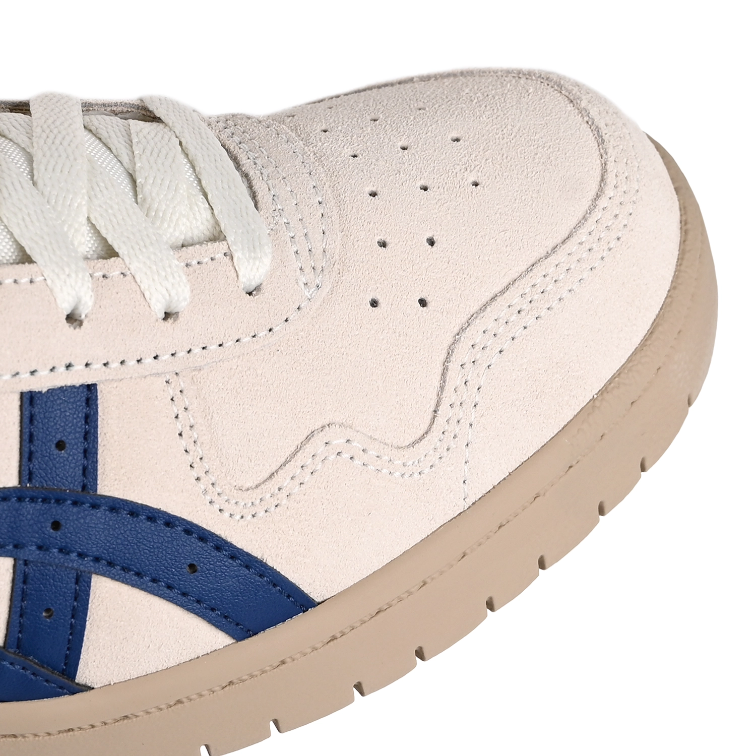 Toe Box of Asics Skateboarding Japan Pro cream and blue sneakers with 'Onitsuka' branding on a white background