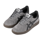 A pair of Carbon and graphite grey ASICS Japan Pro skateboard sneakers with 'Onitsuka' branding on a white background