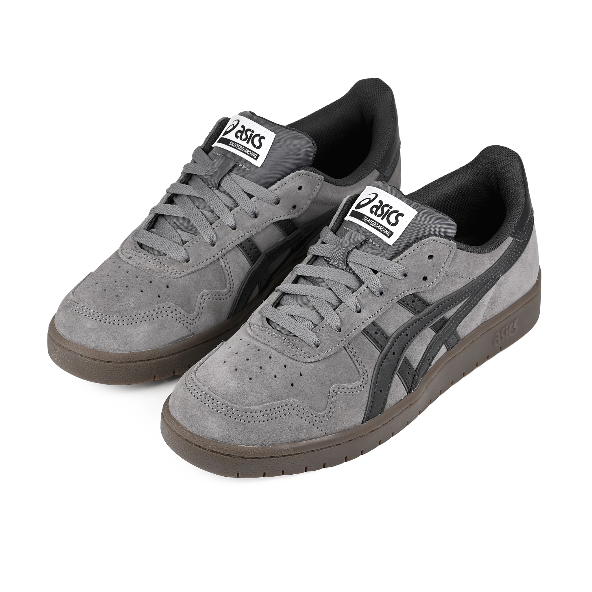 A pair of Carbon and graphite grey ASICS Japan Pro skateboard sneakers with 'Onitsuka' branding on a white background