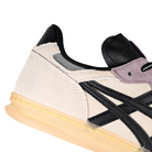 Close up of Oyster grey and black ASICS Skateboarding x Late Nite Stars Leggerezza FB Pro skateboarding sneaker with 'Onitsuka' branding on a white background