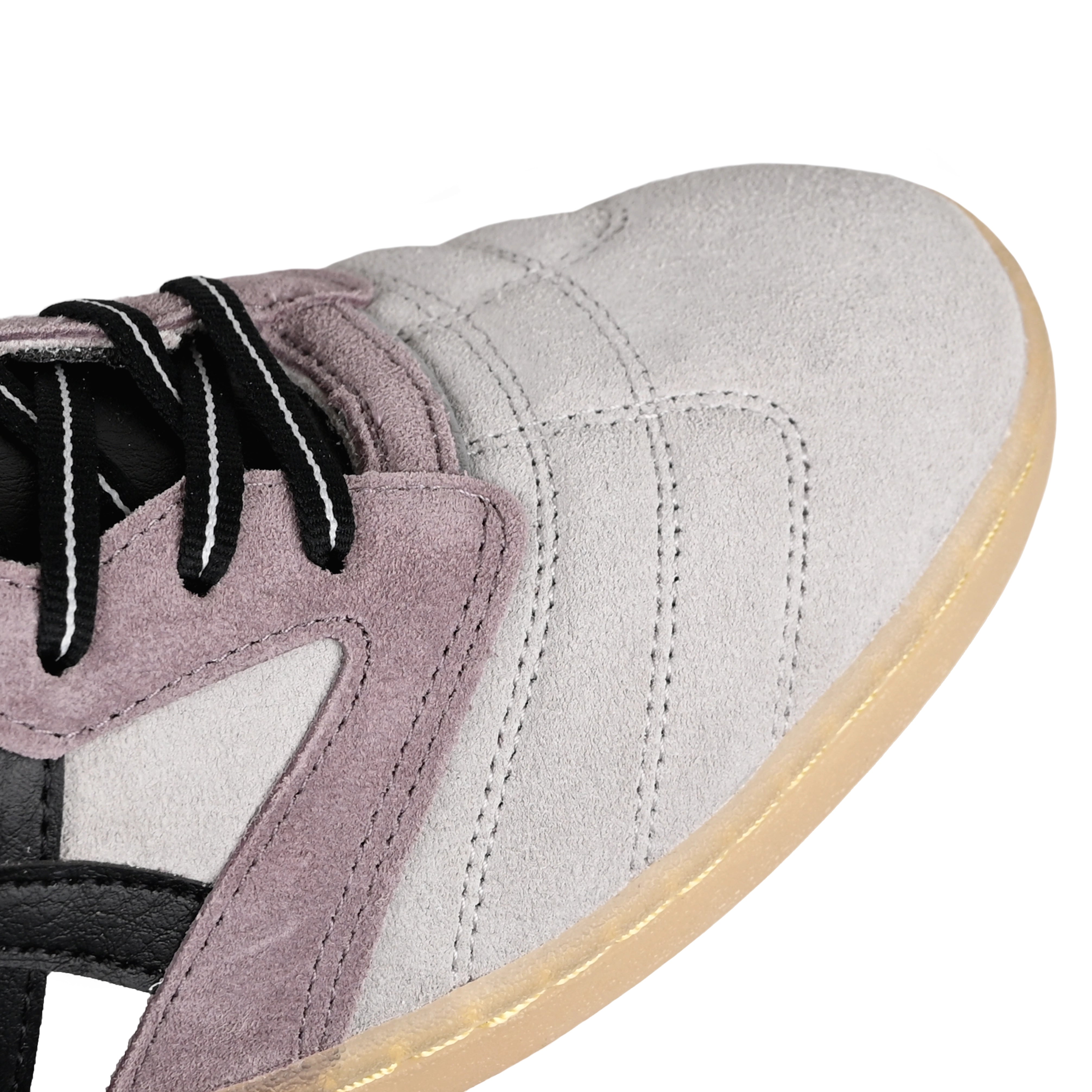 Toe box of Oyster grey and black ASICS Skateboarding x Late Nite Stars Leggerezza FB Pro skateboarding sneaker with 'Onitsuka' branding on a white background