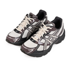 A pair of Oatmeal and obsidian grey Asics Sportstyle GEL-1130 men's lifestyle sneakers with 'Onitsuka' branding on a white background