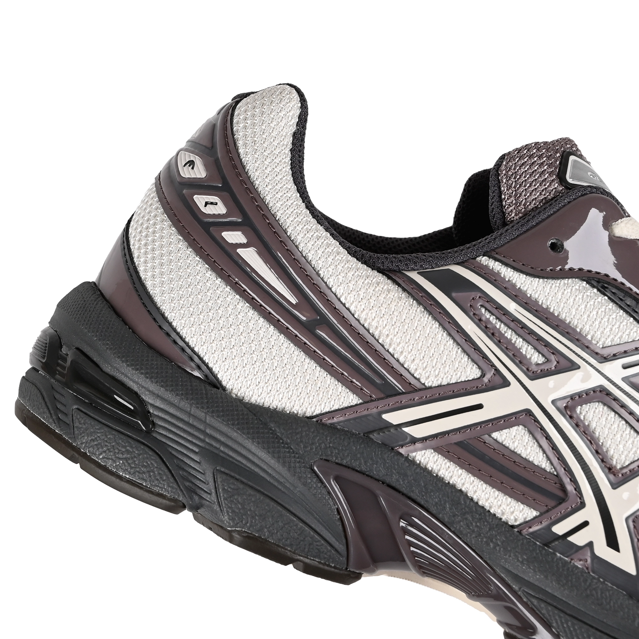 Detail of Oatmeal and obsidian grey Asics Sportstyle GEL-1130 men's lifestyle sneaker with 'Onitsuka' branding on a white background
