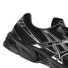Close up of Black ASICS Sportstyle GEL-1130 with pure silver sneaker 'Onitsuka' branding on a white background