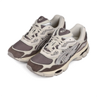 A pair of Cocoa brown ASICS GEL-NYC sportstyle sneakers with silver 'Onitsuka' branding on a white background