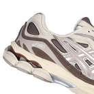 Close up of Cocoa brown ASICS GEL-NYC sportstyle sneaker with silver 'Onitsuka' branding on a white background