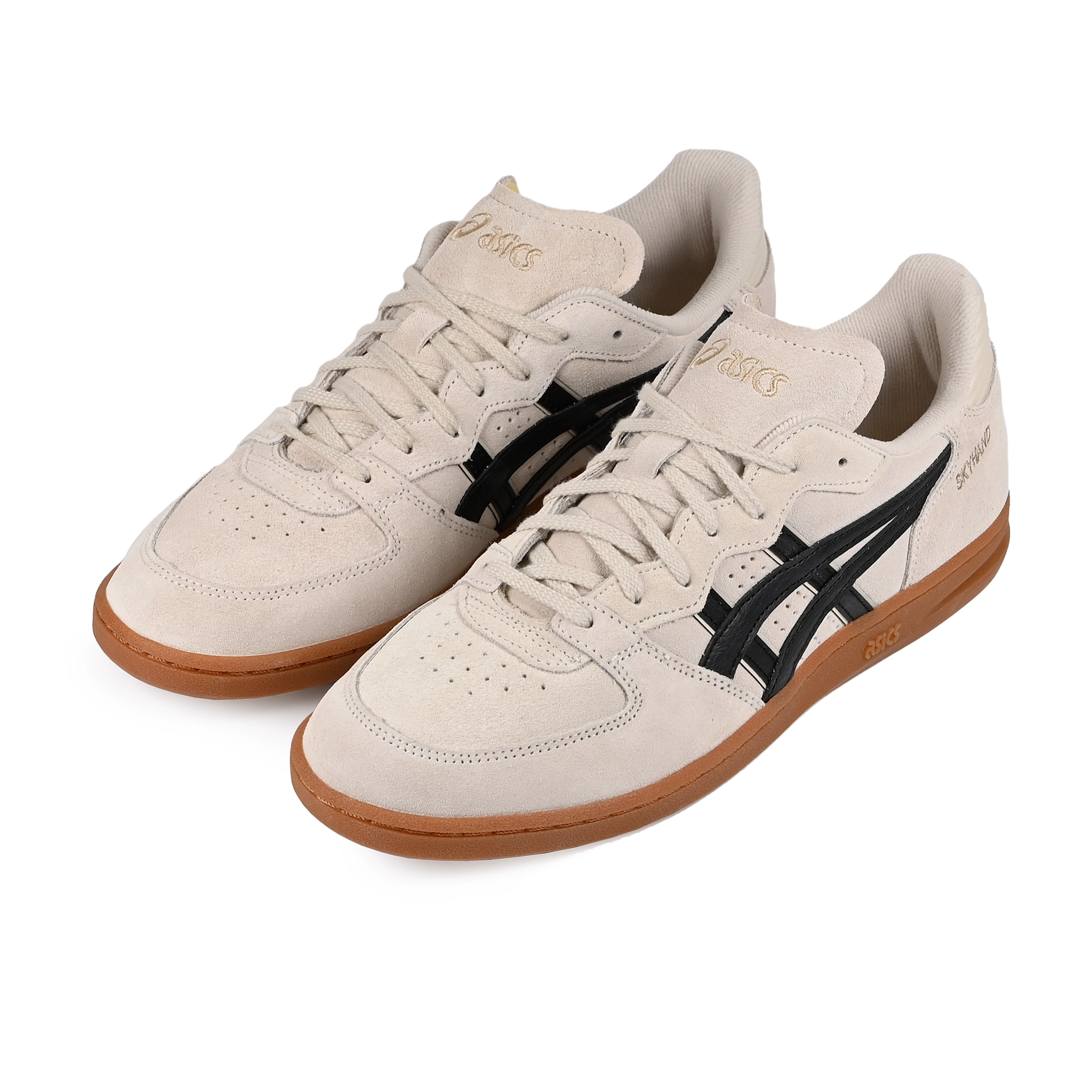 A pair of Oatmeal and black Asics Sportstyle Skyhand OG lifestyle sneakers with 'Onitsuka' branding on a white background