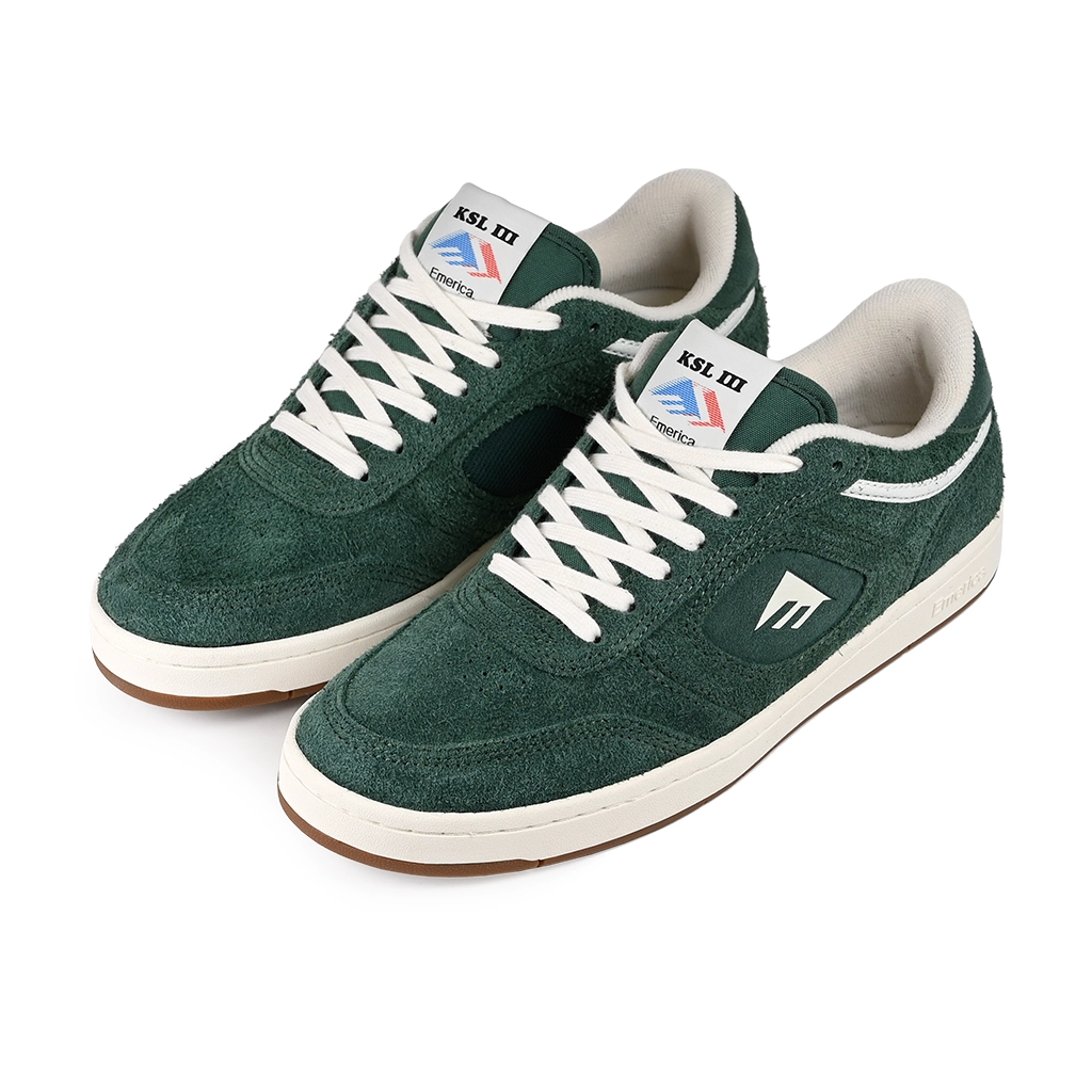 A pair of Emerica Skateboarding KSL III green sneakers with white laces on a white background