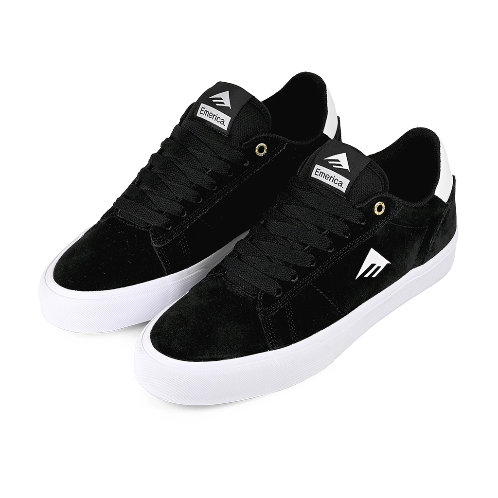 A pair of Emerica Skateboarding MOCA black sneakers with white soles on a white background