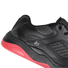 Close up of Black éS Skateboarding TJ Rogers pro model men's skateboard sneaker with red sole on a white background