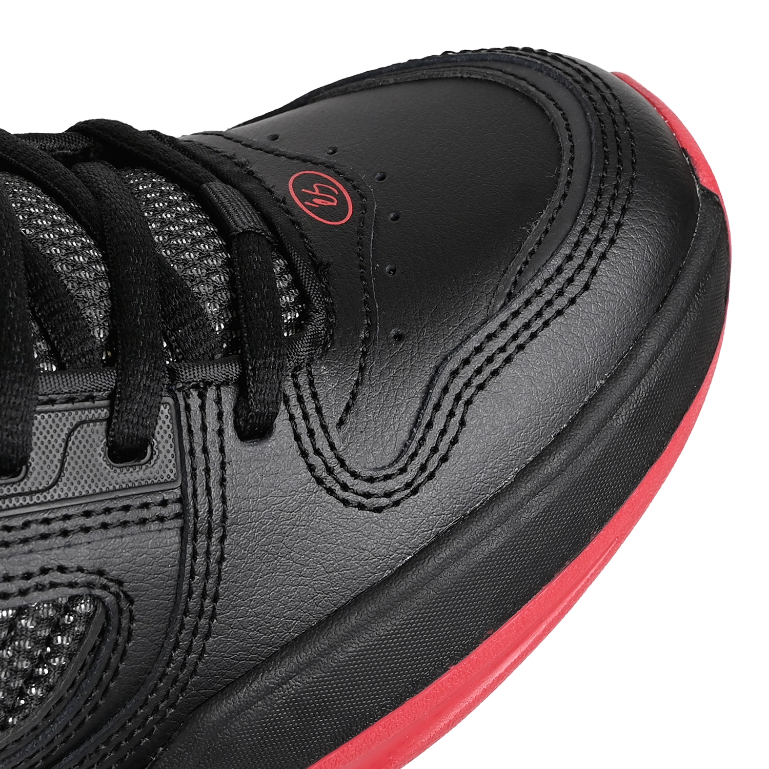 Toe box of Black éS Skateboarding TJ Rogers pro model men's skateboard sneaker with red sole on a white background