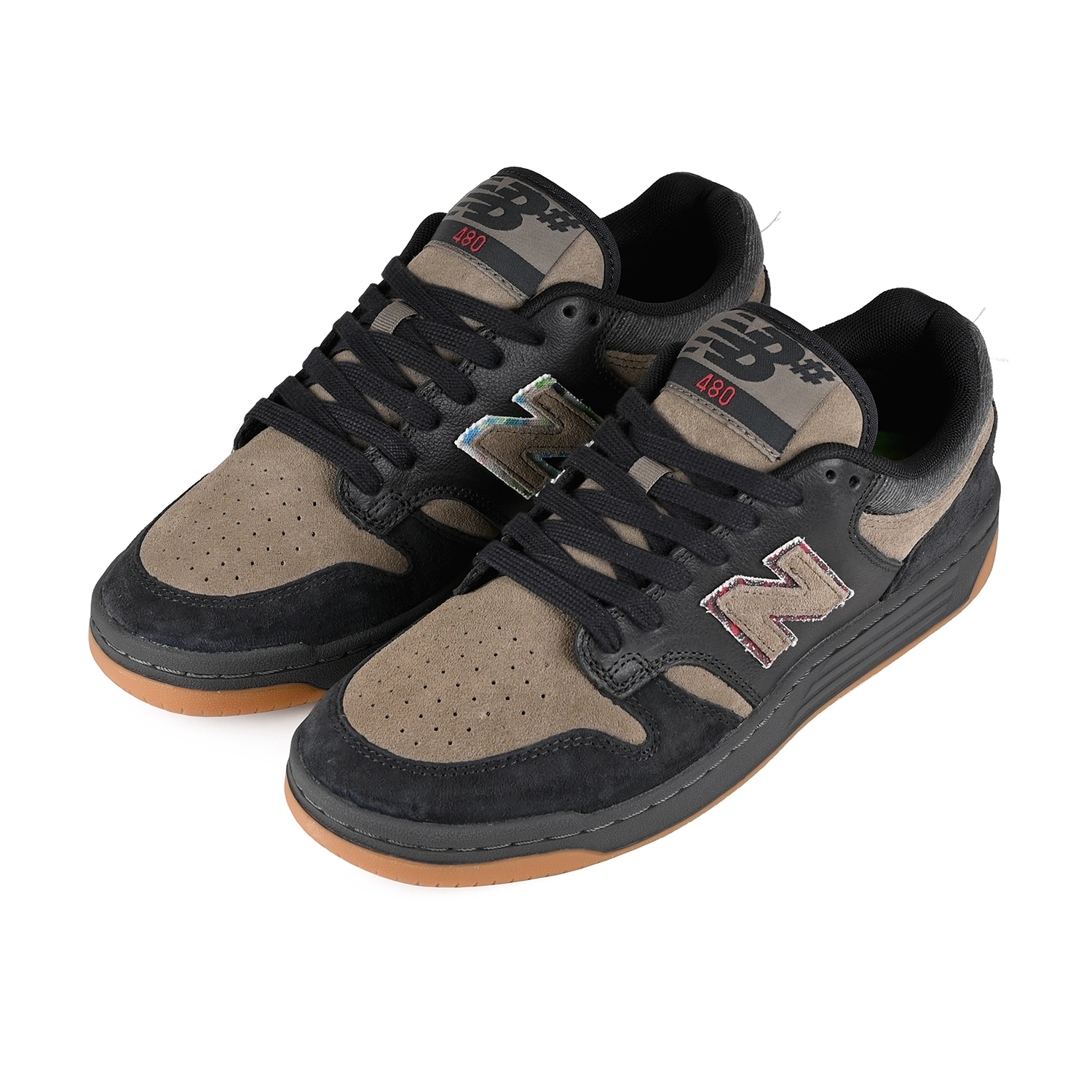 A pair of Black and arid stone New Balance Numeric x No-Comply NM480 skateboard sneakers on a white background