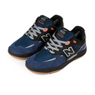 New Balance Numeric NM1010 skate shoes in navy and black with orange accents and a sleek design.