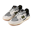 A pair of Sea Salt New Balance Numeric NM1010 Tiago Lemos pro model skateboard sneakers with Dark Olivine branding on a white background