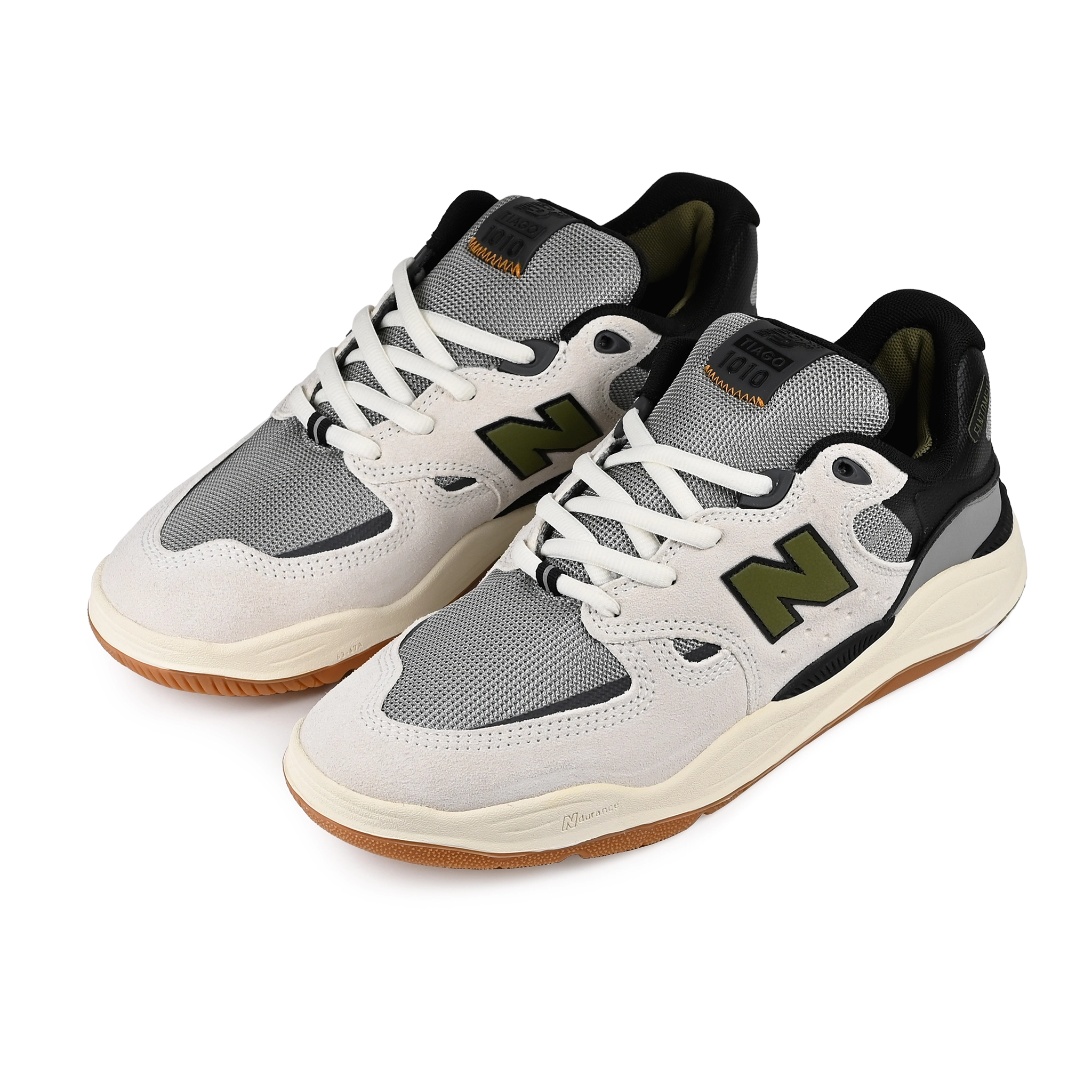 A pair of Sea Salt New Balance Numeric NM1010 Tiago Lemos pro model skateboard sneakers with Dark Olivine branding on a white background