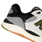 Close up of Sea Salt New Balance Numeric NM1010 Tiago Lemos pro model skateboard sneaker with Dark Olivine branding on a white background