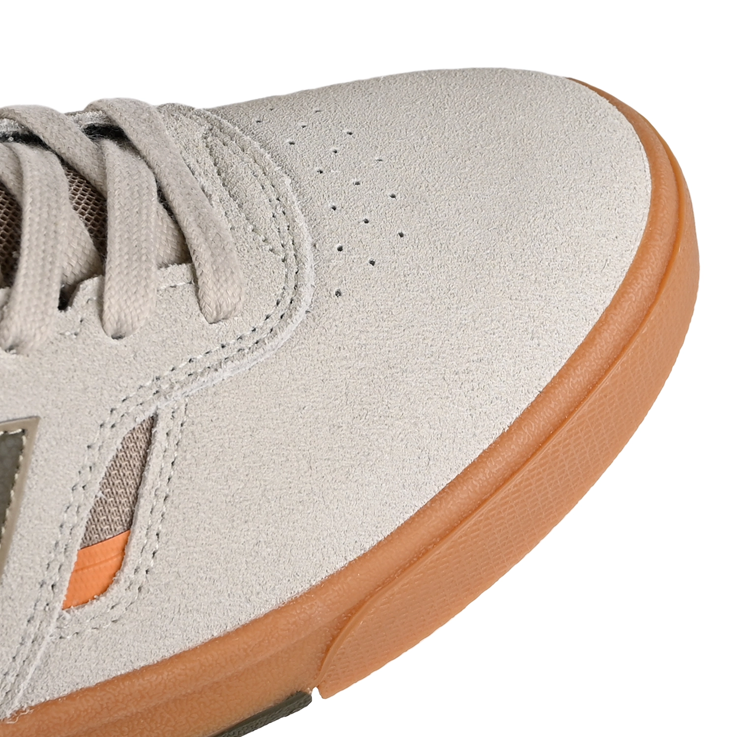 Toe box of Timberwolf and dark moss New Balance Numeric NM306 Cup Jamie Foy pro model men's skateboard sneaker on a white background