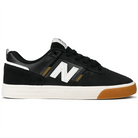 New Balance Numeric NM306 skateboarding shoe in black, white, and gum colorway, featuring durable construction and mesh panels.