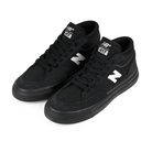 A pair of Black and white New Balance Numeric NM417 Franky Villani pro model mid top men's skateboard sneakers on a white background