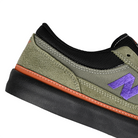 Close up of Dark olivine and electric indigo New Balance Numeric NM417 Franky Villani pro model men's skateboard sneaker on a white background