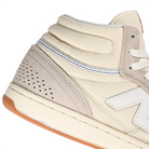 Close up of Grey white New Balance Numeric NM440 high top men's skateboard sneaker on a white background