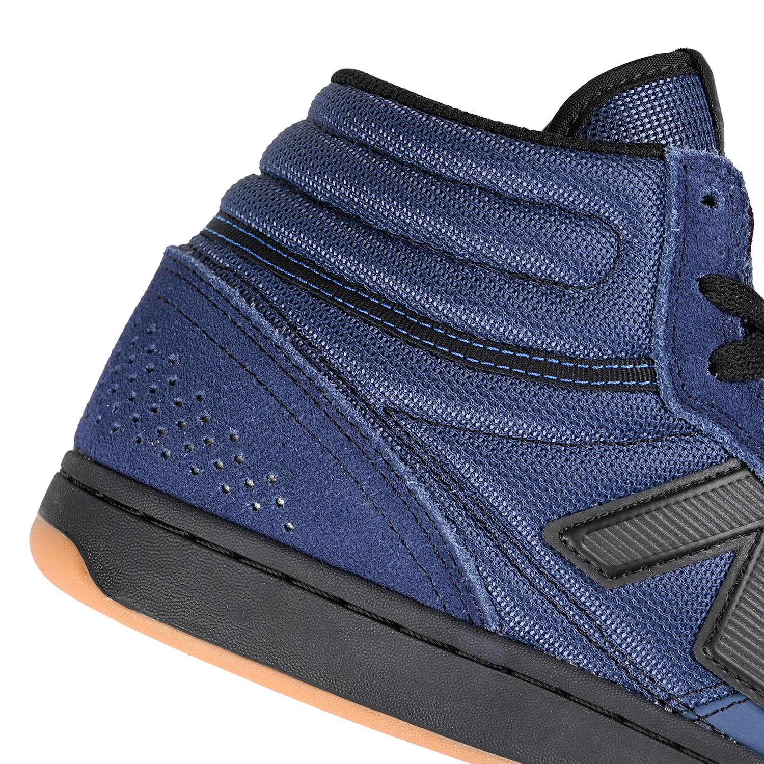 Close up of Vingtage Indigo and black New Balance Numeric NM440 High top men's skateboarding sneaker on a white background