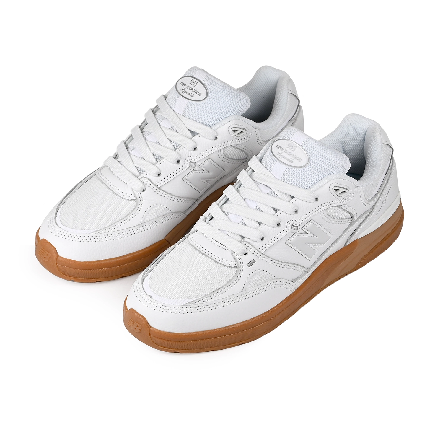 A pair of White and gum New Balance Numeric NM933 Andrew Reynolds pro model men's skateboard sneakers on a white background