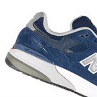 Close up of NB navy New Balance Numeric NM933 Andrew Reynolds pro model skateboard sneaker on a white background