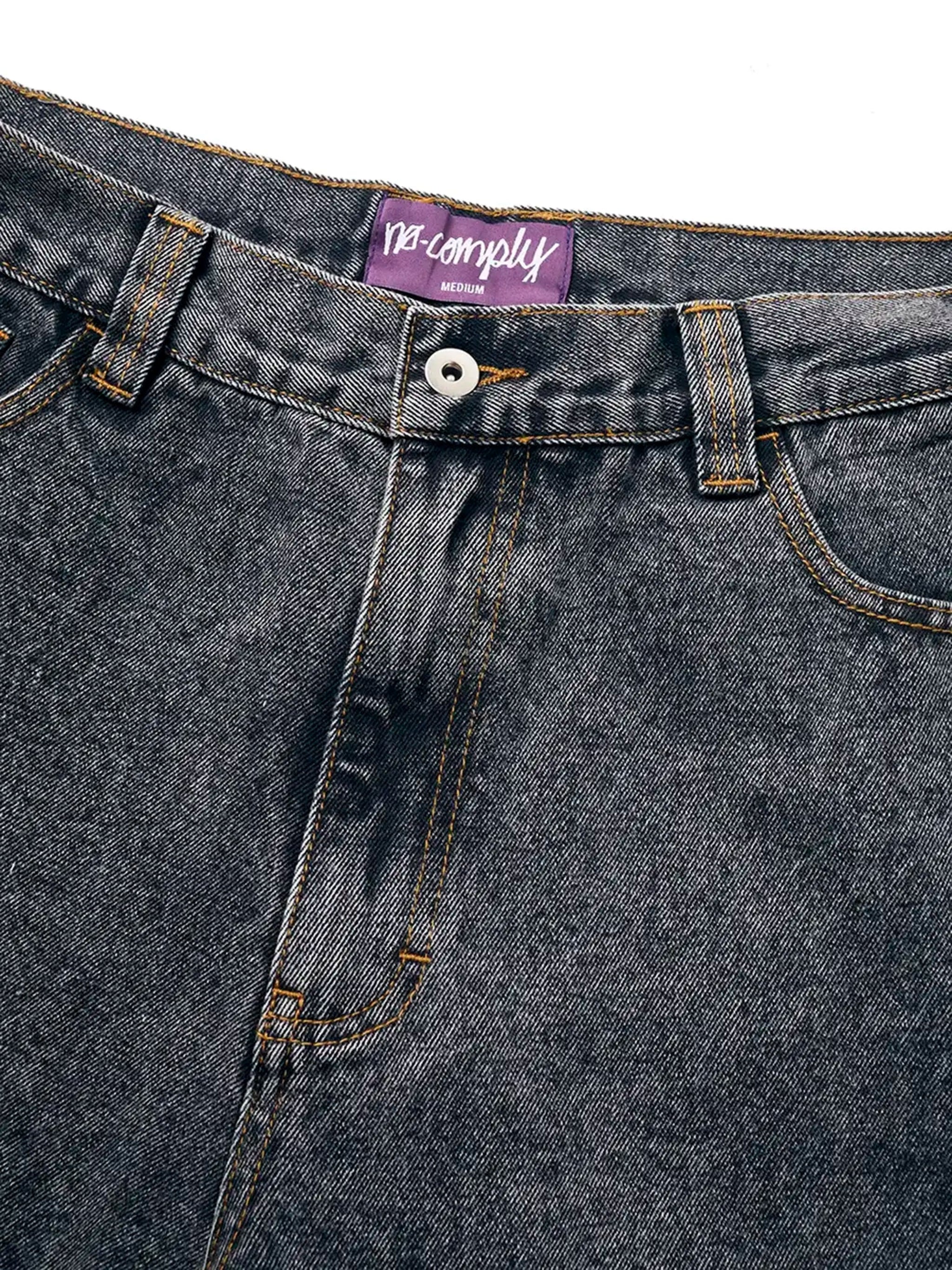 Close up of Black Wash No-Comply Loose Fit denim jeans on a white background